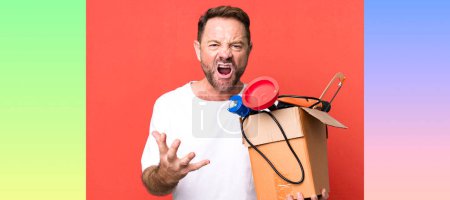 Photo for Middle age man looking angry, annoyed and frustrated. handyman with a toolbox - Royalty Free Image