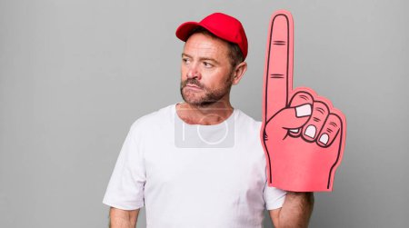 Photo for Middle age man feeling sad, upset or angry and looking to the side. number one fan concept - Royalty Free Image