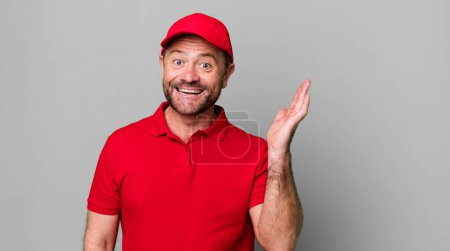 Photo for Middle age man feeling happy, surprised realizing a solution or idea. company employee - Royalty Free Image