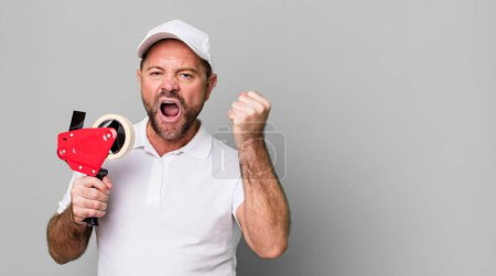 Photo for Middle age man shouting aggressively with an angry expression. company employee - Royalty Free Image