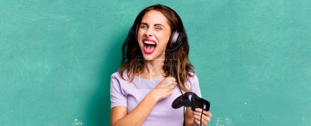 Photo for Hispanic pretty woman feeling happy and facing a challenge or celebrating. gamer concept - Royalty Free Image