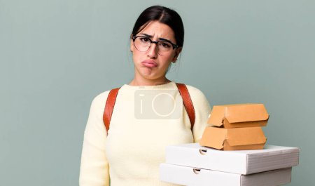 Photo for Feeling sad and whiney with an unhappy look and crying. fast food delivery or take away - Royalty Free Image