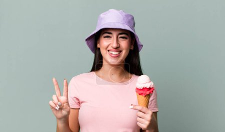 Photo for Smiling and looking friendly, showing number two. ice cream and summer concept - Royalty Free Image