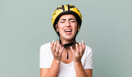 Foto de Looking desperate, frustrated and stressed. bike helmet concept - Imagen libre de derechos
