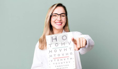 Photo for Pretty blonde woman with a optical vision test - Royalty Free Image
