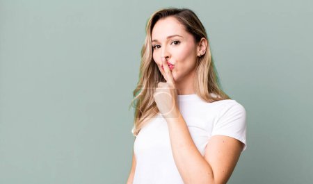 Photo for Asking for silence and quiet, gesturing with finger in front of mouth, saying shh or keeping a secret - Royalty Free Image