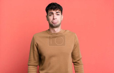 Photo for Man feeling sad and whiney with an unhappy look, crying with a negative and frustrated attitude - Royalty Free Image