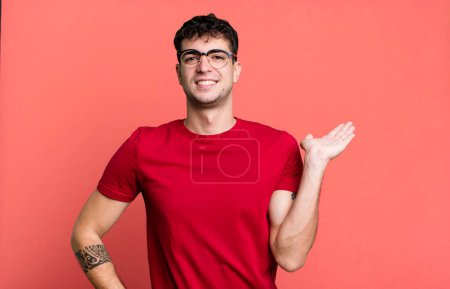 Photo for Smiling, feeling confident, successful and happy, showing concept or idea on copy space on the side - Royalty Free Image