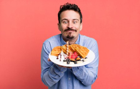 Photo for Adult man having waffles for breakfast - Royalty Free Image