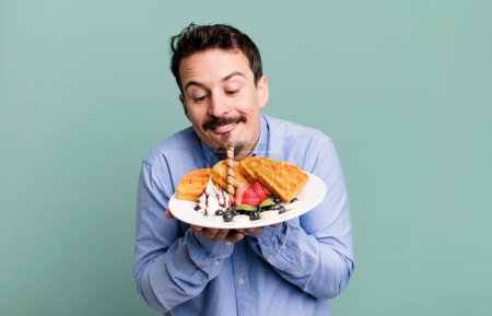 Photo for Adult man having waffles for breakfast - Royalty Free Image