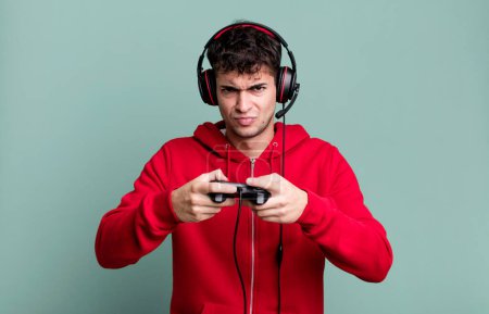 Téléchargez les photos : Adult man with headset and a control. gamer concept - en image libre de droit