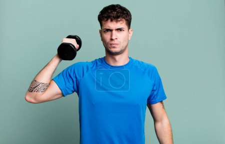 Photo for Adult man lifting a dumbbell and fitness concept - Royalty Free Image