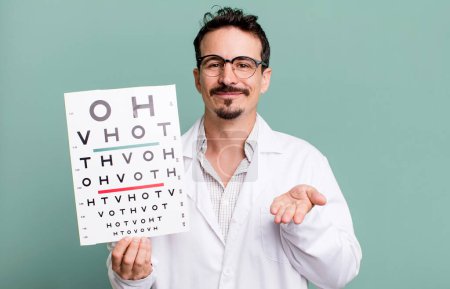 Photo for Adult man smiling happily with friendly and  offering and showing a concept. optical vision test concept - Royalty Free Image