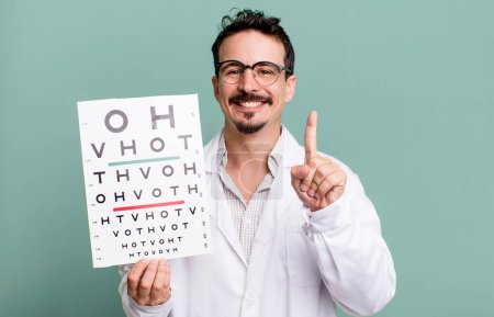 Photo for Adult man smiling proudly and confidently making number one. optical vision test concept - Royalty Free Image