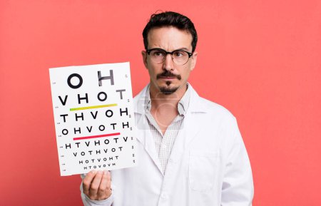 Foto de Adult man feeling sad, upset or angry and looking to the side. optical vision test concept - Imagen libre de derechos