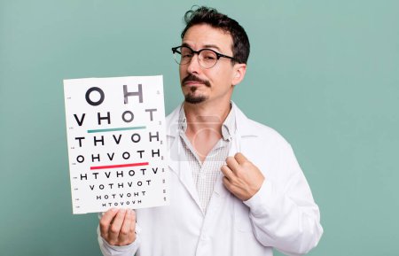 Foto de Adult man looking arrogant, successful, positive and proud. optical vision test concept - Imagen libre de derechos