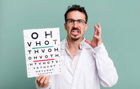 Photo for Adult man screaming with hands up in the air. optical vision test concept - Royalty Free Image