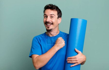 Photo for Adult man feeling happy and facing a challenge or celebrating. fitness and yoga concept - Royalty Free Image