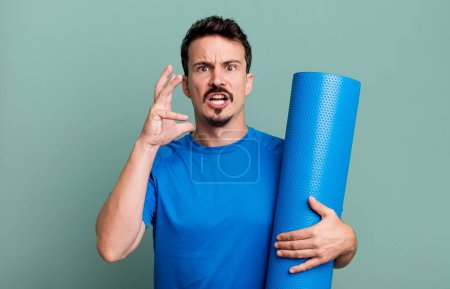 Photo for Adult man screaming with hands up in the air. fitness and yoga concept - Royalty Free Image