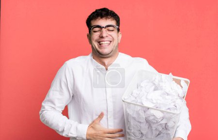 Photo for Adult man laughing out loud at some hilarious joke. paper balls mistakes trash - Royalty Free Image