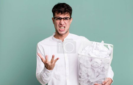 Photo for Adult man looking angry, annoyed and frustrated. paper balls mistakes trash - Royalty Free Image