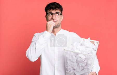 Photo for Adult man thinking, feeling doubtful and confused. paper balls mistakes trash - Royalty Free Image