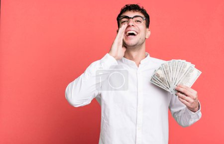 Photo for Adult man feeling happy,giving a big shout out with hands next to mouth. dollar banknotes concept - Royalty Free Image