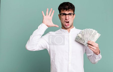 Photo for Adult man screaming with hands up in the air. dollar banknotes concept - Royalty Free Image
