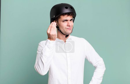 Photo for Adult man making capice or money gesture, telling you to pay. city motorbike rider concept - Royalty Free Image