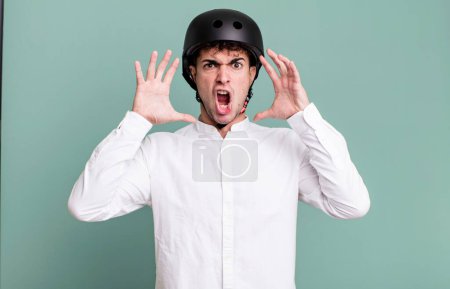 Photo for Adult man screaming with hands up in the air. city motorbike rider concept - Royalty Free Image