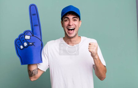Photo for Adult man feeling shocked,laughing and celebrating success. number one fan concept - Royalty Free Image