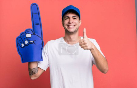 Photo for Adult man feeling proud,smiling positively with thumbs up. number one fan concept - Royalty Free Image
