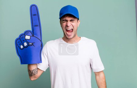 Photo for Adult man shouting aggressively, looking very angry. number one fan concept - Royalty Free Image
