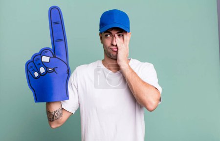 Photo for Adult man feeling bored, frustrated and sleepy after a tiresome. number one fan concept - Royalty Free Image