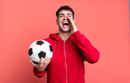 Photo for Adult man feeling happy,giving a big shout out with hands next to mouth. soccer and sport concept - Royalty Free Image