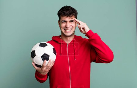 Photo for Adult man feeling confused and puzzled, showing you are insane. soccer and sport concept - Royalty Free Image