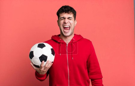Photo for Adult man shouting aggressively, looking very angry. soccer and sport concept - Royalty Free Image