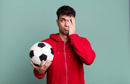Photo for Adult man feeling bored, frustrated and sleepy after a tiresome. soccer and sport concept - Royalty Free Image
