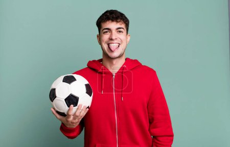 Photo for Adult man feeling disgusted and irritated and tongue out. soccer and sport concept - Royalty Free Image