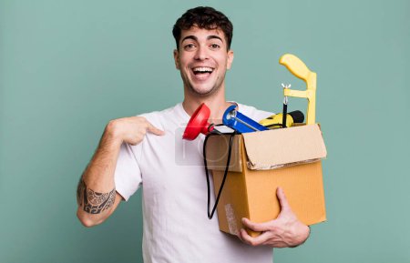Photo for Adult man feeling happy and pointing to self with an excited with a toolbox. housekeeper concept - Royalty Free Image