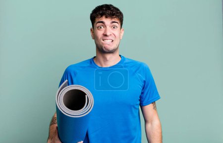Photo for Adult man looking puzzled and confused. fitness and yoga concept - Royalty Free Image