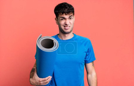 Photo for Adult man feeling puzzled and confused. fitness and yoga concept - Royalty Free Image