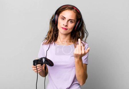 Photo for Hispanic pretty woman feeling angry, annoyed, rebellious and aggressive. gamer concept - Royalty Free Image