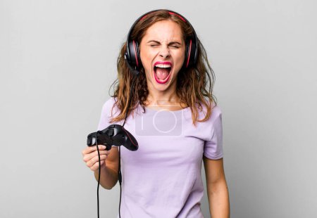 Photo for Hispanic pretty woman shouting aggressively, looking very angry. gamer concept - Royalty Free Image