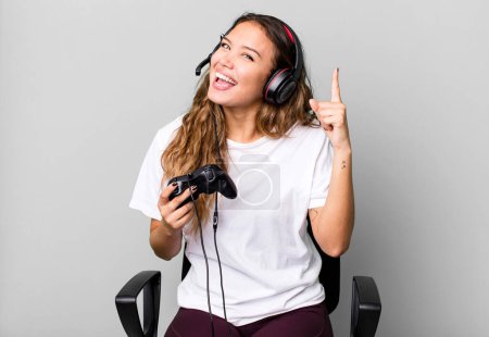 Photo for Hispanic pretty woman feeling like a happy and excited genius after realizing an idea. gamer concept - Royalty Free Image