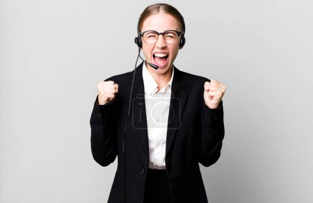 Photo for Caucasian pretty woman shouting aggressively with an angry expression. telemarketing concept - Royalty Free Image