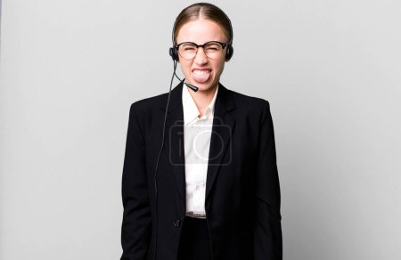 Photo for Caucasian pretty woman feeling disgusted and irritated and tongue out. telemarketing concept - Royalty Free Image