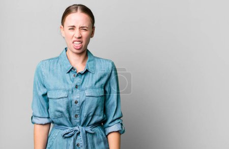 Photo for Caucasian pretty woman feeling disgusted and irritated and tongue out - Royalty Free Image