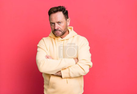 Photo for Feeling displeased and disappointed, looking serious, annoyed and angry with crossed arms - Royalty Free Image