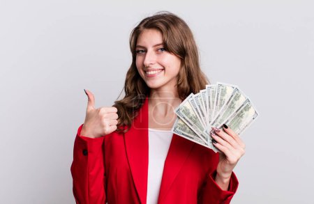 Photo for Young pretty businesswoman with dollar banknotes - Royalty Free Image
